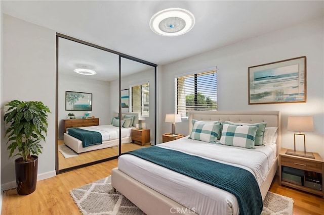 2621 E 20th St Unit 12, Signal Hill, CA 90755 - bedroom featuring wood finished floors and a closet