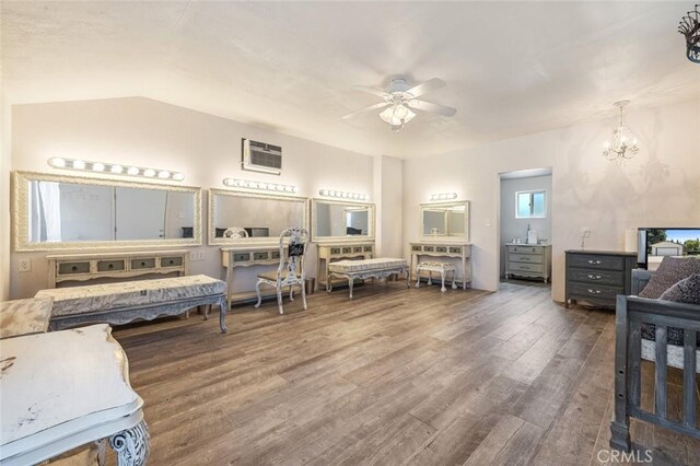 4742 Crow Rd, Oakdale, CA 95361 - bedroom featuring wood finished floors, a wall unit AC, and a chandelier
