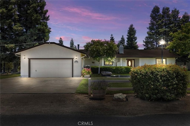 4742 Crow Rd, Oakdale, CA 95361 - ranch-style house featuring driveway, a garage, a chimney, and stucco siding