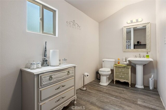 4742 Crow Rd, Oakdale, CA 95361 - full bath with wood finished floors, lofted ceiling, and a shower with curtain