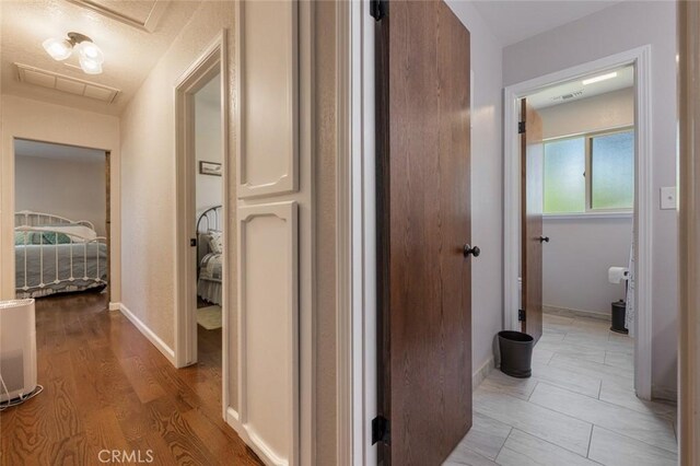 4742 Crow Rd, Oakdale, CA 95361 - hall featuring light wood-style flooring and baseboards