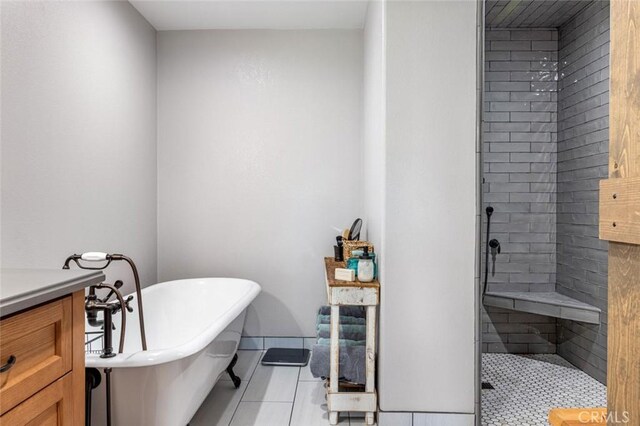 4742 Crow Rd, Oakdale, CA 95361 - bathroom with a soaking tub, a tile shower, tile patterned flooring, and vanity