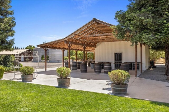 4742 Crow Rd, Oakdale, CA 95361 - view of home's community with a lawn, area for grilling, and a patio
