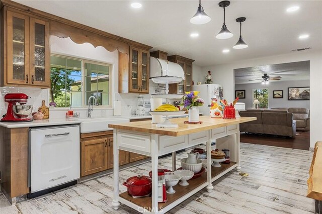 4742 Crow Rd, Oakdale, CA 95361 - kitchen with white appliances, ceiling fan, butcher block counters, recessed lighting, and healthy amount of natural light