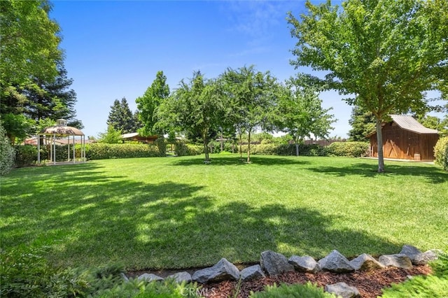 4742 Crow Rd, Oakdale, CA 95361 - view of green lawn featuring a gazebo and an outbuilding