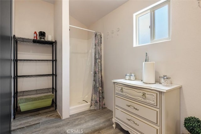 4742 Crow Rd, Oakdale, CA 95361 - bathroom with wood finished floors, lofted ceiling, a shower with curtain, and vanity
