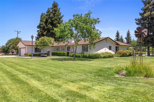 4742 Crow Rd, Oakdale, CA 95361 - ranch-style home with an attached garage, a front lawn, stucco siding, and driveway