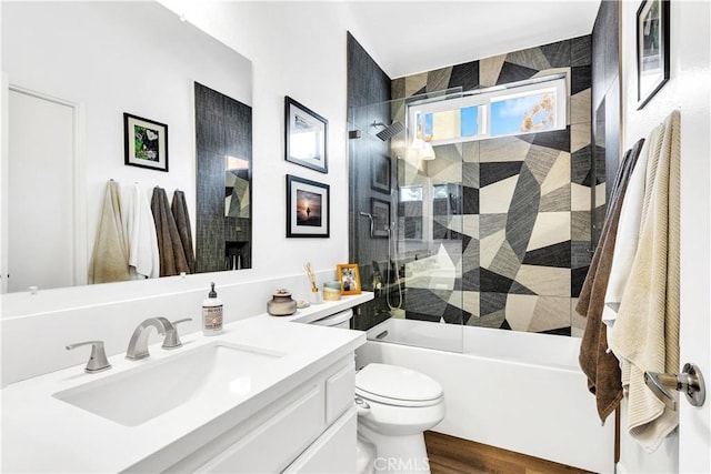 2 Daytona Unit 129, Laguna Niguel, CA 92677 - bathroom featuring vanity, shower / bath combination with glass door, and wood finished floors