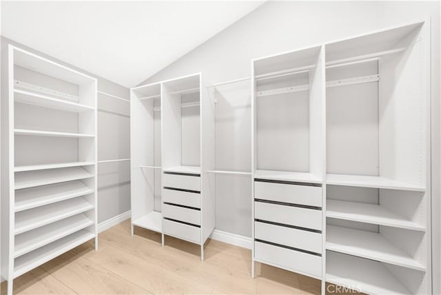 25981 Cordillera Dr, Mission Viejo, CA 92691 - walk in closet featuring vaulted ceiling and wood finished floors