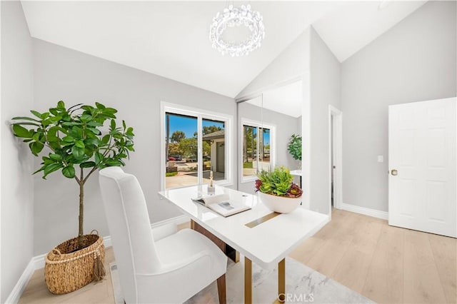 25981 Cordillera Dr, Mission Viejo, CA 92691 - dining area with light wood-style floors, high vaulted ceiling, and a chandelier