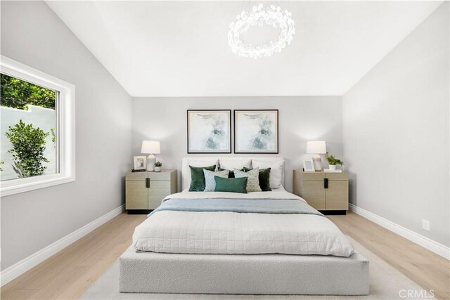 25981 Cordillera Dr, Mission Viejo, CA 92691 - bedroom featuring vaulted ceiling and light wood-style flooring