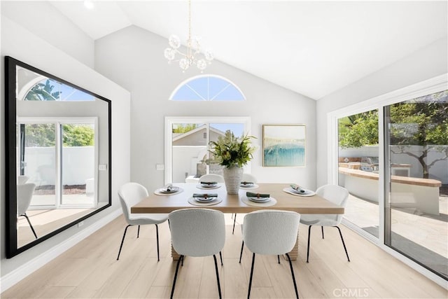 25981 Cordillera Dr, Mission Viejo, CA 92691 - dining space with vaulted ceiling, light wood-type flooring, and a chandelier