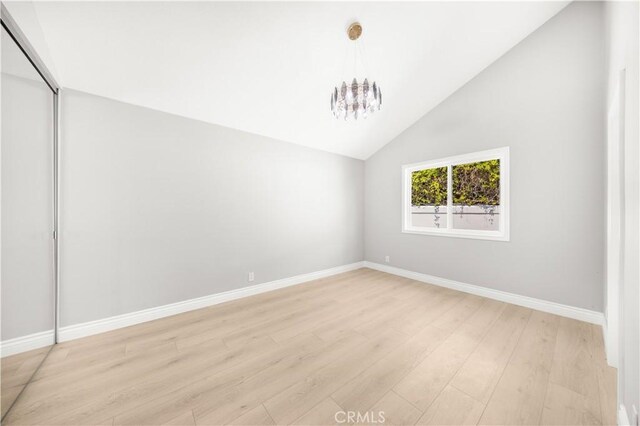 25981 Cordillera Dr, Mission Viejo, CA 92691 - spare room with a chandelier, light wood finished floors, and lofted ceiling