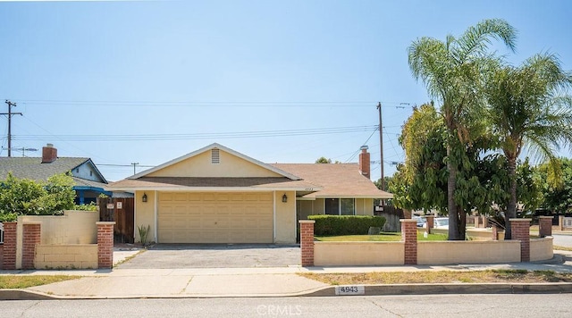 4943 Bresee Ave, Baldwin Park, CA 91706 - view of front of property featuring a garage, asphalt driveway, and stucco siding