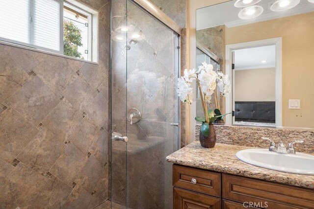 4943 Bresee Ave, Baldwin Park, CA 91706 - bathroom featuring crown molding, vanity, and a stall shower