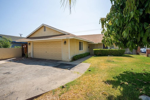 4943 Bresee Ave, Baldwin Park, CA 91706 - view of home's exterior with an attached garage, stucco siding, and asphalt driveway