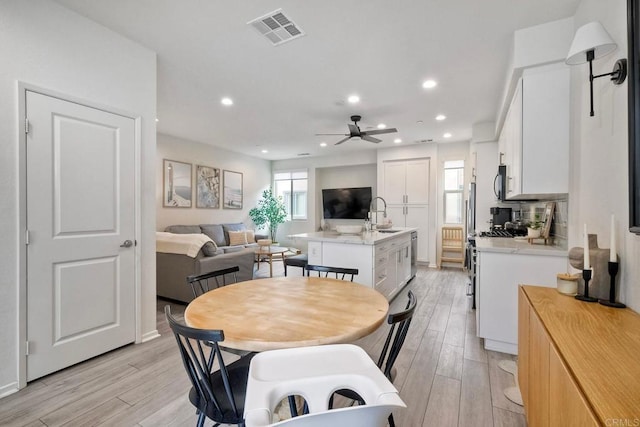 1201 Via Lucero, Oceanside, CA 92056 - dining area with a ceiling fan, light wood-style floors, and recessed lighting