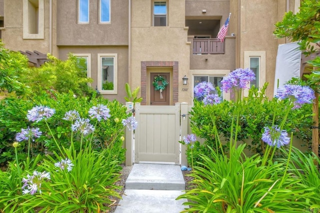 1201 Via Lucero, Oceanside, CA 92056 - view of exterior entry featuring a gate and stucco siding