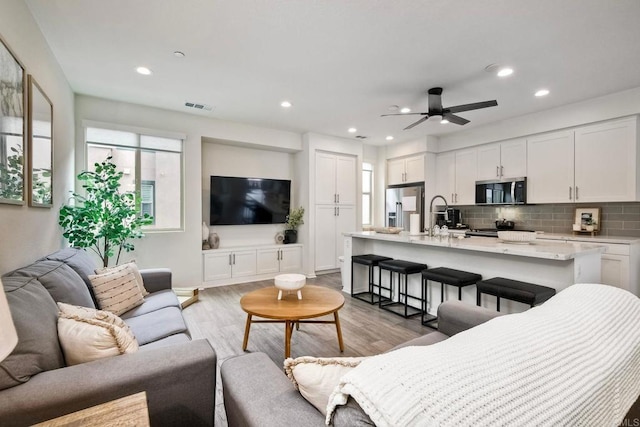 1201 Via Lucero, Oceanside, CA 92056 - living room with ceiling fan, recessed lighting, and light wood-style floors
