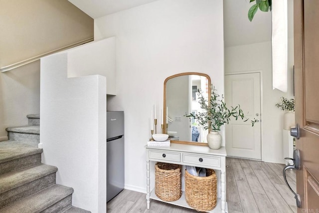 1201 Via Lucero, Oceanside, CA 92056 - entrance foyer featuring light wood-style flooring and stairway
