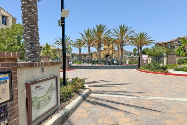 1201 Via Lucero, Oceanside, CA 92056 - view of street with a gate, a residential view, curbs, and a gated entry