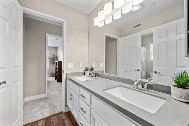 2435 Bear Rock, Escondido, CA 92026 - full bathroom featuring double vanity and wood finished floors