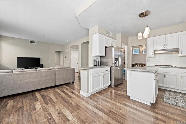 2435 Bear Rock, Escondido, CA 92026 - kitchen featuring stainless steel fridge with ice dispenser, white cabinetry, dark wood-style flooring, open floor plan, and under cabinet range hood