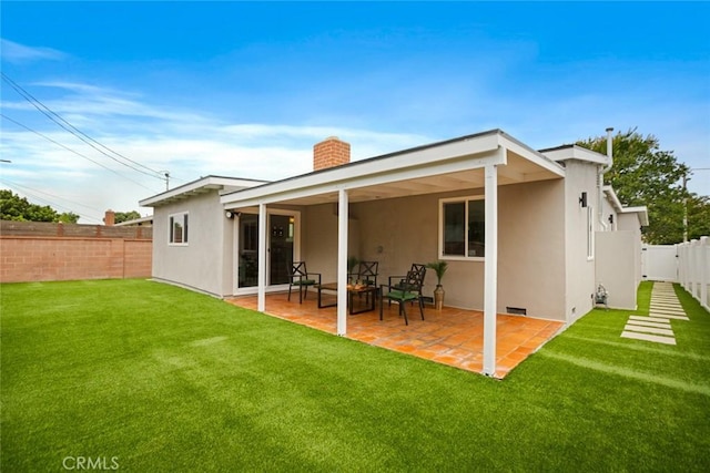 6118 Wolfe St, Lakewood, CA 90713 - rear view of house with a chimney, a fenced backyard, stucco siding, and a patio area