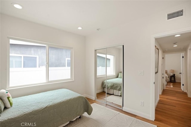 6118 Wolfe St, Lakewood, CA 90713 - bedroom with light wood finished floors, a closet, and recessed lighting