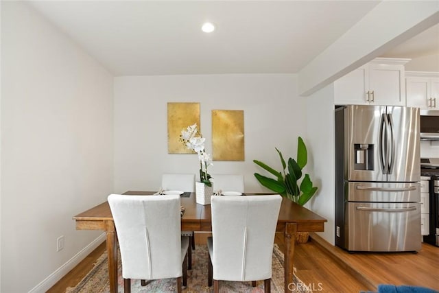 6118 Wolfe St, Lakewood, CA 90713 - dining area featuring wood finished floors and recessed lighting