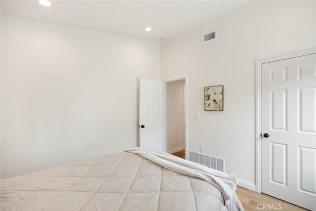 6118 Wolfe St, Lakewood, CA 90713 - bedroom with light wood-style floors and recessed lighting