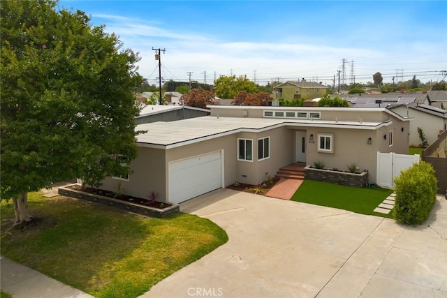 6118 Wolfe St, Lakewood, CA 90713 - mid-century home with a garage, stucco siding, and driveway