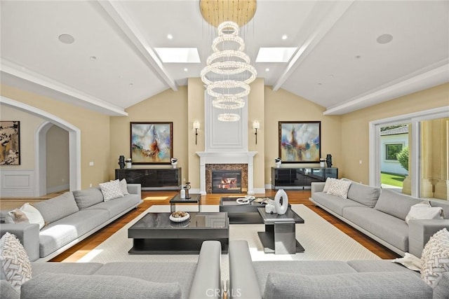 300 W Las Flores Ave, Arcadia, CA 91007 - living area featuring a skylight, wood finished floors, arched walkways, a chandelier, and a large fireplace