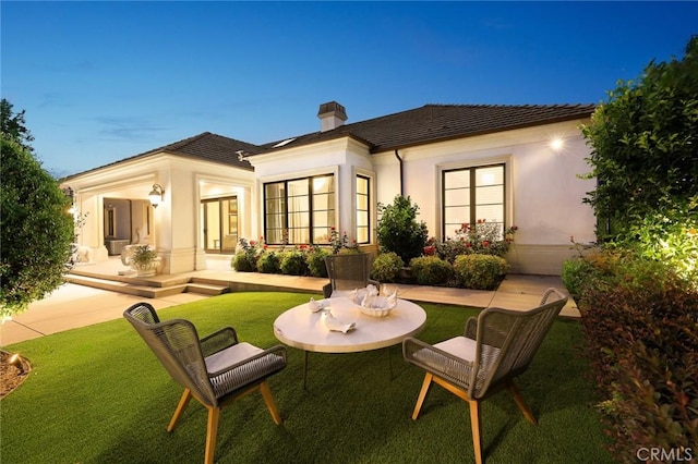 300 W Las Flores Ave, Arcadia, CA 91007 - back of property featuring a chimney, stucco siding, and a lawn