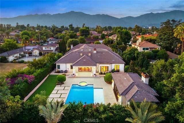 300 W Las Flores Ave, Arcadia, CA 91007 - back of house featuring a mountain view, a tile roof, a pool with connected hot tub, a patio area, and stucco siding