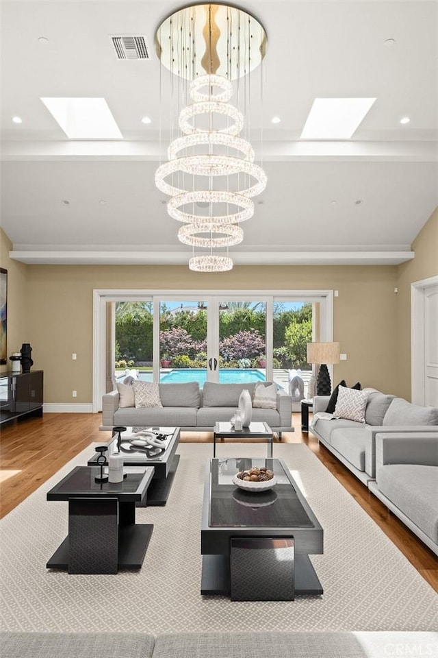 300 W Las Flores Ave, Arcadia, CA 91007 - living area featuring a skylight, wood finished floors, and a chandelier