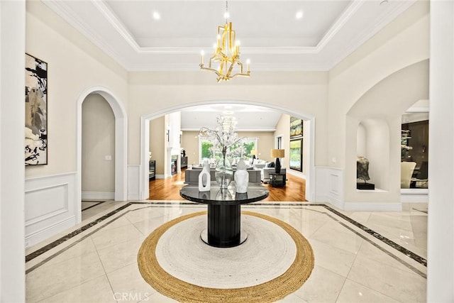 300 W Las Flores Ave, Arcadia, CA 91007 - foyer with a chandelier, inlaid floor details, arched walkways, ornamental molding, and a high ceiling