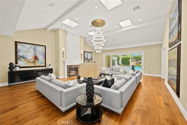 300 W Las Flores Ave, Arcadia, CA 91007 - living room with a skylight, a premium fireplace, light wood finished floors, recessed lighting, and a chandelier