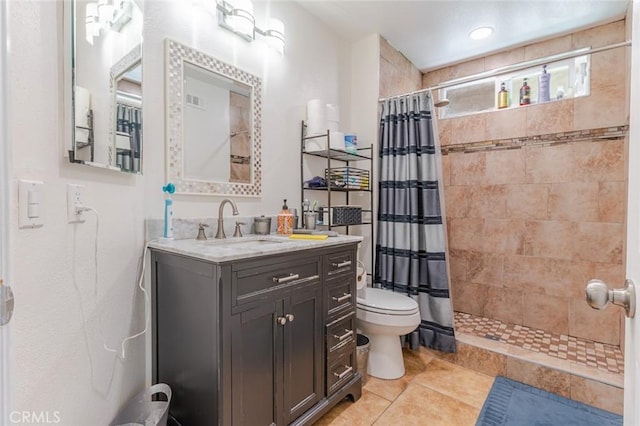 38342 5th Pl W, Palmdale, CA 93551 - bathroom featuring tiled shower, vanity, and tile patterned floors