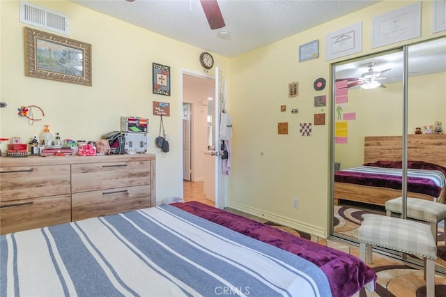 38342 5th Pl W, Palmdale, CA 93551 - bedroom featuring a textured ceiling, ceiling fan, and a closet