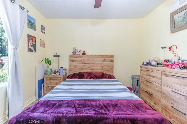 38342 5th Pl W, Palmdale, CA 93551 - bedroom with a textured ceiling and a ceiling fan
