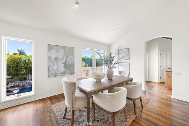 520 Kings Rd, Newport Beach, CA 92663 - dining room with arched walkways, light wood-type flooring, and lofted ceiling