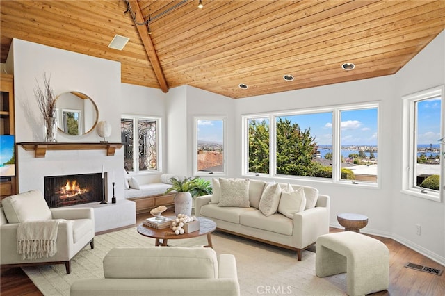 520 Kings Rd, Newport Beach, CA 92663 - living area with wooden ceiling, vaulted ceiling, a warm lit fireplace, and wood finished floors