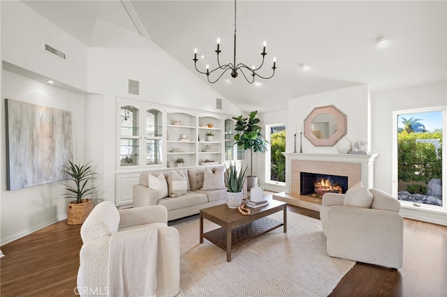 520 Kings Rd, Newport Beach, CA 92663 - living area featuring wood finished floors, high vaulted ceiling, a chandelier, recessed lighting, and a fireplace