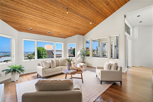 520 Kings Rd, Newport Beach, CA 92663 - living area with wood ceiling, plenty of natural light, rail lighting, wood finished floors, and high vaulted ceiling