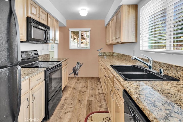 2713 Turkey Cove Rd, Bradley, CA 93426 - kitchen featuring black appliances, light wood-type flooring, light brown cabinetry, and healthy amount of natural light