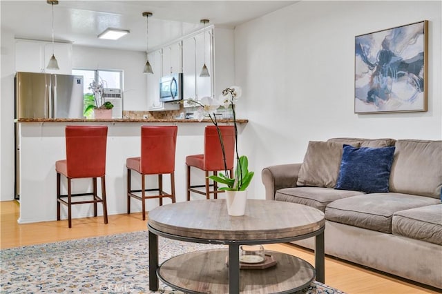 18530 Hatteras St Unit 220, Tarzana, CA 91356 - living area featuring light wood-style flooring