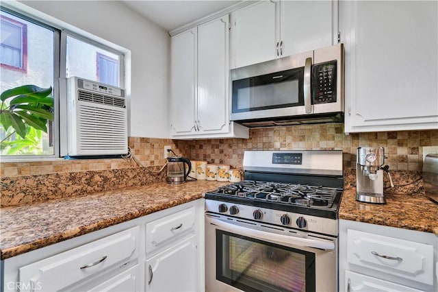18530 Hatteras St Unit 220, Tarzana, CA 91356 - kitchen with appliances with stainless steel finishes, white cabinetry, decorative backsplash, and stone counters