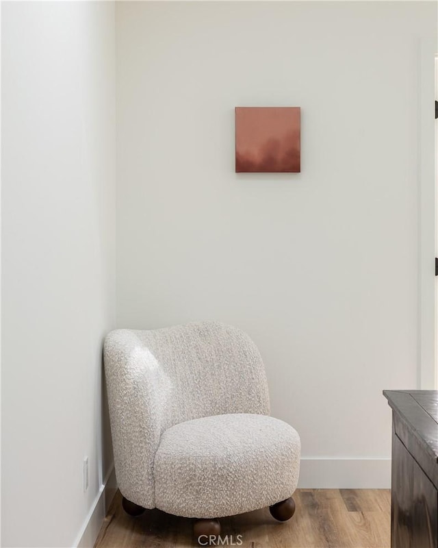 212 E 19th St, Costa Mesa, CA 92627 - living area featuring baseboards and wood finished floors