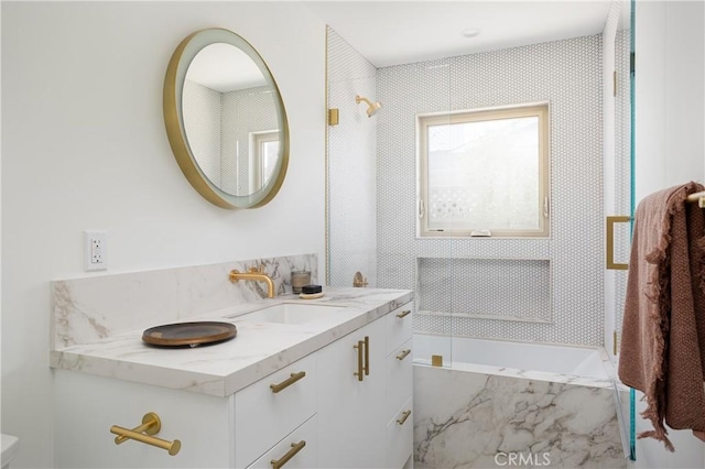 212 E 19th St, Costa Mesa, CA 92627 - bathroom featuring vanity and a tub with marble appearance